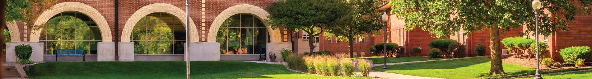 View of library windows exterior on a sunny day.